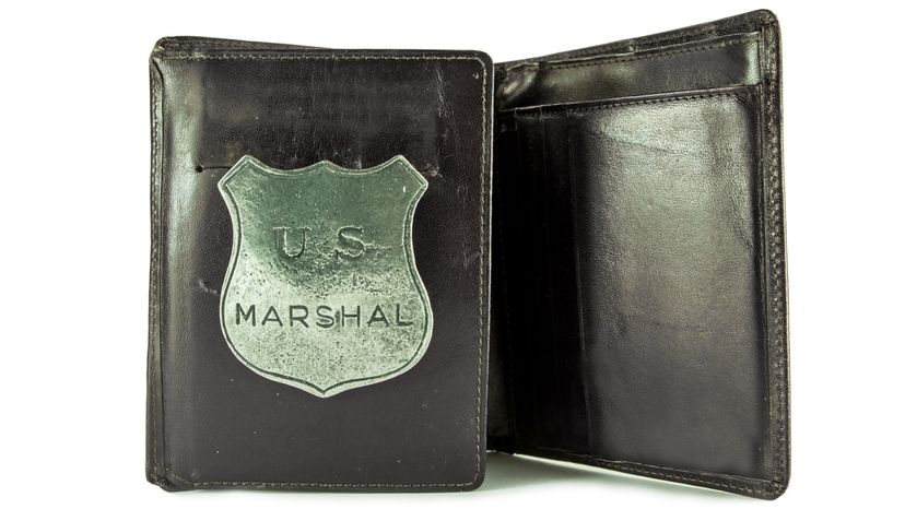 An old marshal badge in a wallet.