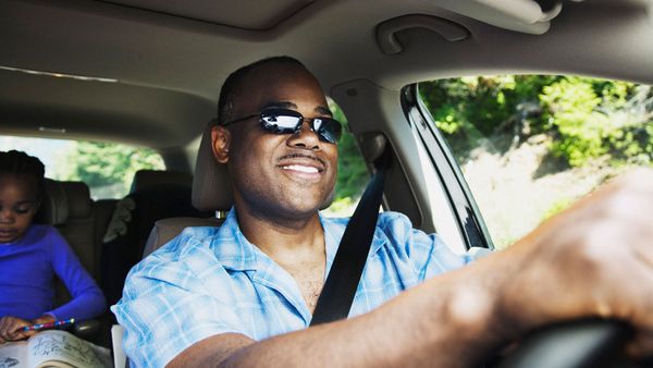 man driving car