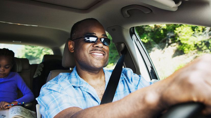 man driving car