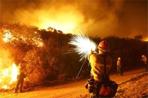 Firefighter holding flare gun