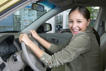 happy woman in car