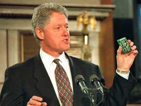 President Image Gallery US President Bill Clinton holds up a V-chip during ceremonies where he signed the Telecommunications Reform Act, February 8, 1996. See more president pictures.