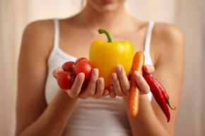 Woman holding vegetables