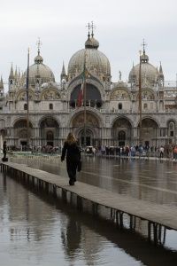 To cope with the flood conditions, elevated walkways have been constructed to help residents go about their business, as shown here in front of the Basilica of San Marco.
