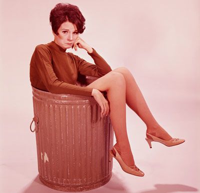 woman in trash can