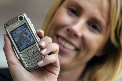 woman shown on video phone