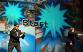 Careers in video game design can play a good wage especially for those at the top. Here, Reggie Fils-Aime, president of Nintendo America, plays Wii against Cammie Dunaway, executive vide president.