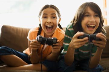 girl, boy playing video game