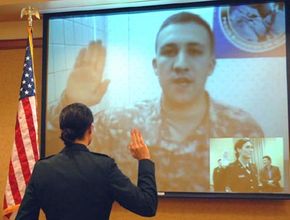 Bridget Kingsley receives the oath of office from her husband 2nd Lieutenant Dan Kingsley in Iraq.