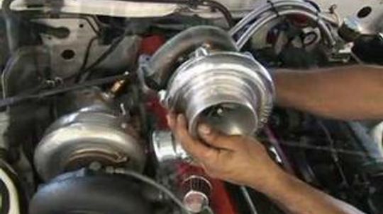 How do you make a wastegate adjustment on a turbocharger?