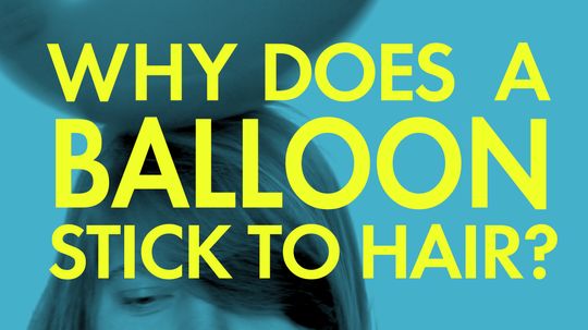 Why does a balloon stick to hair?