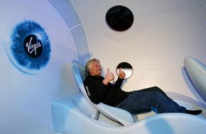 Sir Richard Branson gives a thumbs-up during the unveiling of a scale model of SpaceShipTwo in 2006.
