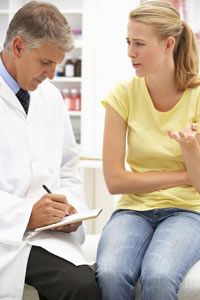 Woman speaking with doctor