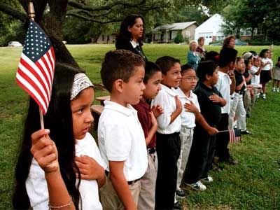 Monolingual hispanic students earn english, and practice with the pledge of allegiance in Tyler, TX.