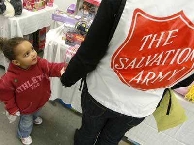 Salvation Army volunteer helping child pick out toy, Christmas 2008.