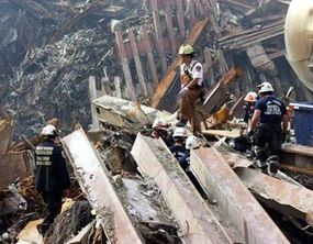 Rescue workers search through the rubble, two weeks after the attack.