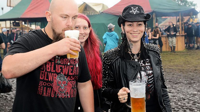 Festival visitors drink beer during the Wacken Open Air festival on Aug. 3, 2016, in Wacken, Germany. Didier Messens/Getty Images