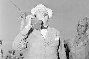 Prime Minister Winston Churchill speaking on a walkie-talkie during a visit to Fort Jackson in June 1942.