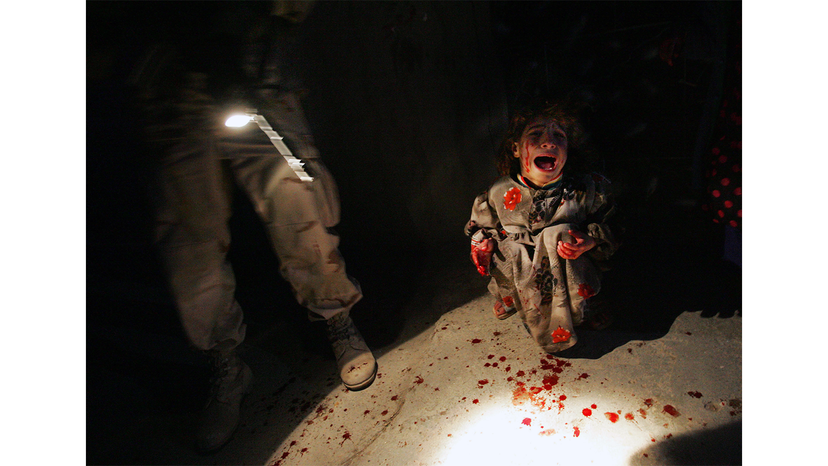 Chris Hondros' image of Samar Hassan, 5, shows how fast things can go wrong during war. Hassan is screaming and covered in blood after her parents were killed by U.S. soldiers in a 2005 shooting in Tal Afar, Iraq. The troops fired on the Hassan family car when it unwittingly approached them during a dusk patrol in the tense northern Iraqi town. Chris Hondros/Getty Images