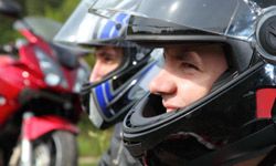 two motorcyclists helmets