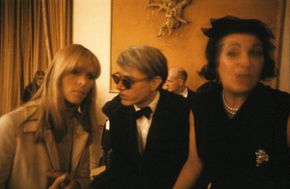Artist Andy Warhol (center) chats with Nico of The Velvet Underground at a dinner for the New York Society of Clinical Psychiatry in January 1966.