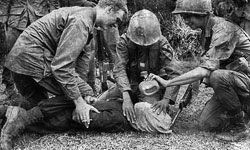 Vietnam, 1968: A U.S. soldier questions an enemy suspect with the help of a water-boarding technique.