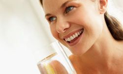 Young Woman Drinking A Glass Of Water