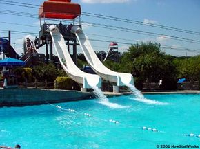 The simplest sort of water slide is a small, curved hill that is lubricated by a stream of water.