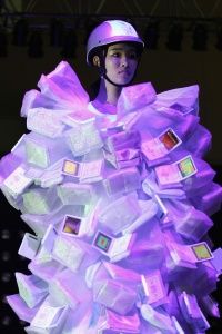 A model wearing a designer dress that's made of smart devices.&nbsp;