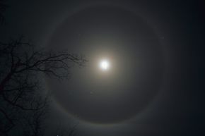 A halo encircles the moon, courtesy of some ice crystals.