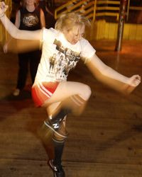 Punk aerobics instructor Hilken Mancini teaches a move called "You Be the Star Air Guitar."