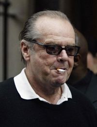 Actor Jack Nicholson smokes a cigarette as he leaves Claridge's hotel in London Feb. 2, 2004. A major goal of wellness programs is to get participants to quit smoking.