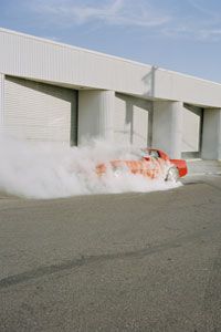 Somewhere in this haze of smoke, a precision driver performs a wicked burnout.