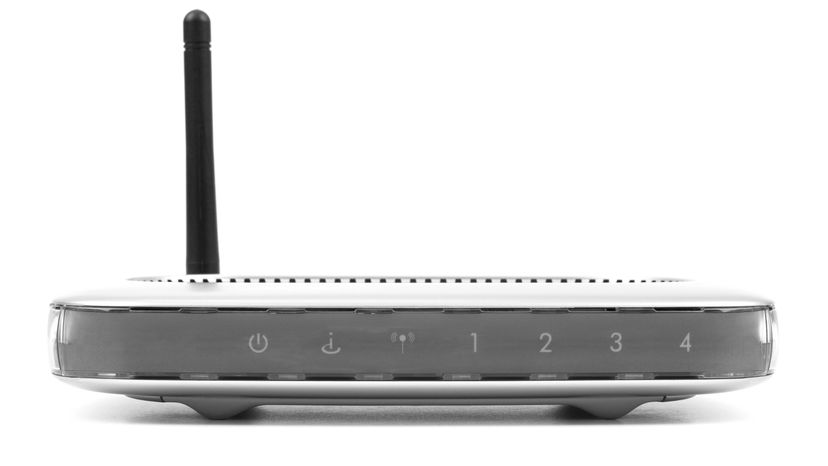 A wireless router placed against a white background. 