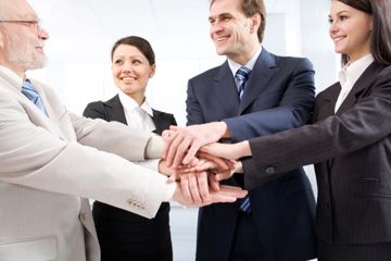 group of people clasping hands
