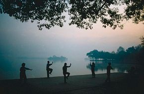 Photo of people practicing tai chi.