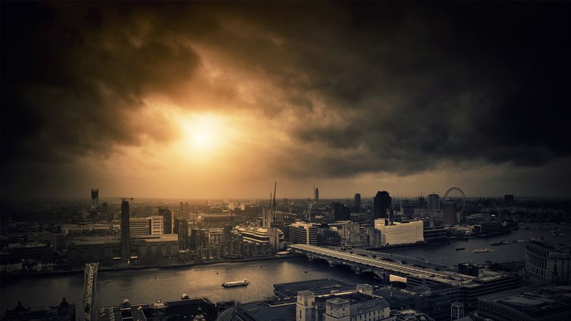 An overhead shot of London, with dark grey cloud and haze blocking out the sun.