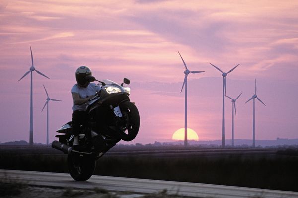 Motorcyclist performing wheelie