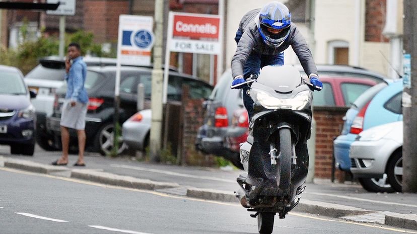 motorcyclist popping wheelie