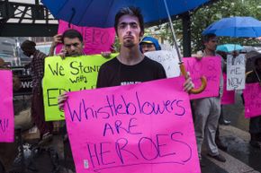 Supporters of whistleblower Edward J. Snowden at a New York City rally in June 2013.