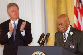 Ninety-four-year-old Herman Shaw, one of the unknowing patients in the Tuskegee Syphilis Study, speaks during ceremonies at the White House in 1997 in which U.S. President Bill Clinton apologized to the survivors and families of the victims of the study.