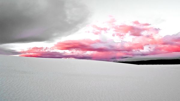 Beautiful sunset sky over sandy landscape.