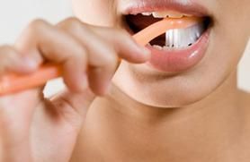 woman brushing her teeth photo