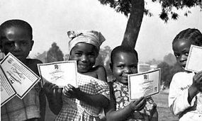 Children of Cameroon, Africa, with their smallpox vaccination certificates