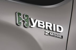 A hybrid badge on a 2009 Chevrolet Silverado -- the first full-size, full hybrid pickup truck on the market.