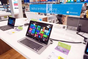 New Microsoft laptops in a store.