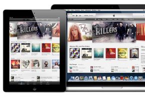 iTunes content seen on a MacBook and tablet.