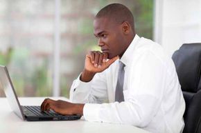 Businessman working on a laptop computer.