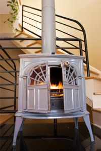A wood stove burning in a modern condo