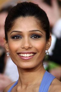 Actress Freida Pinto makes her eyes pop with smoky blue liner and deep plum shadow.